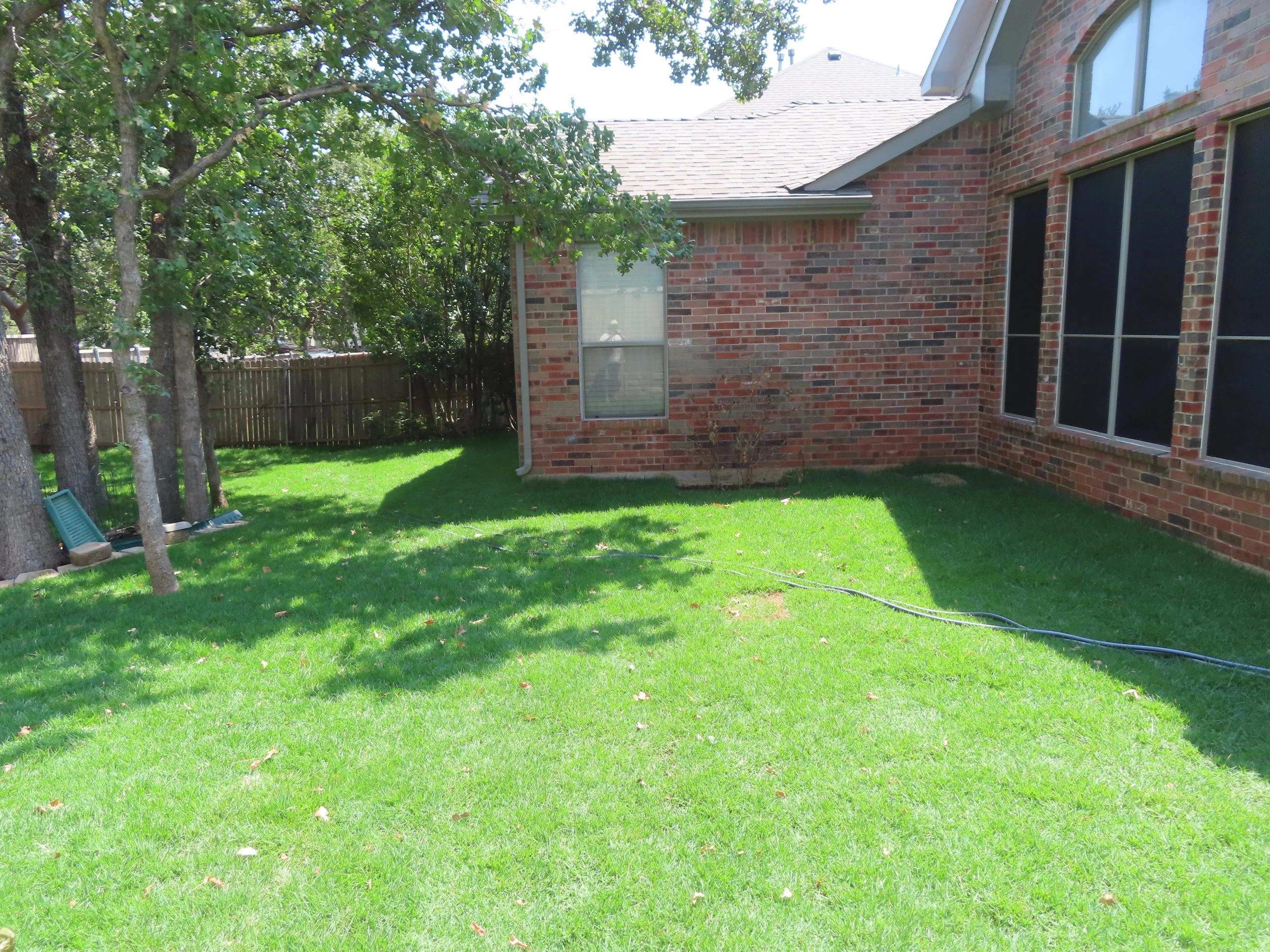 Backyard landscape design with decorative pathway